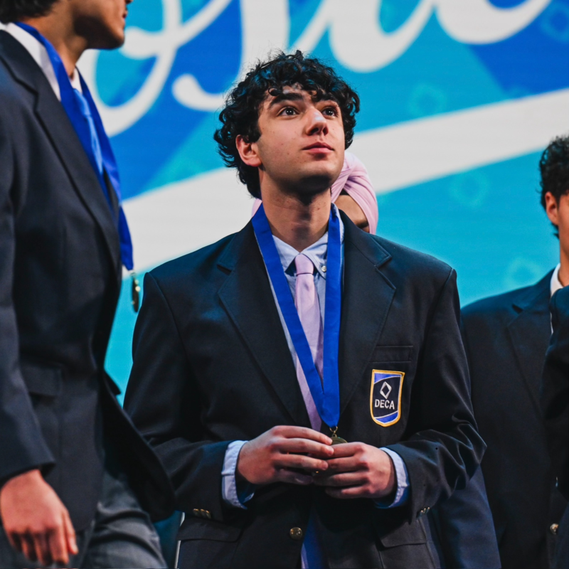 Kurosh Kavoosi on stage at DECA ICDC 2026
